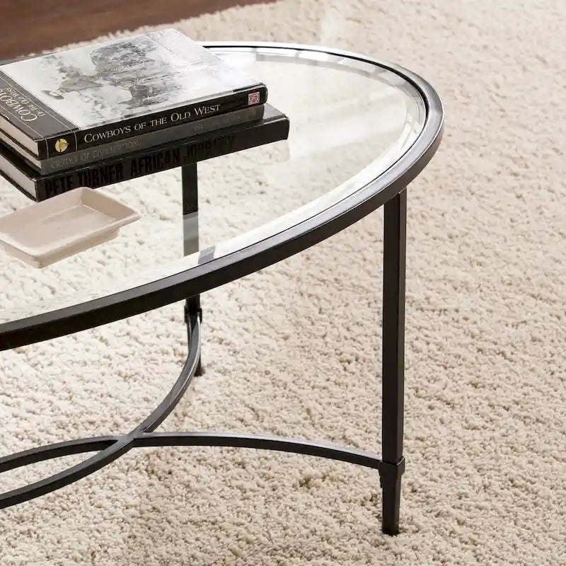 Table basse ovale en métal noir mat avec plateau en verre